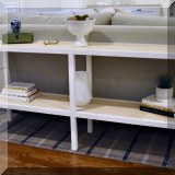 F14. Serena & Lily tiered painted wicker console table. 30”h x 64”w x 15”d 